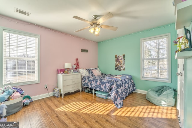 bedroom featuring ceiling fan and light hardwood / wood-style flooring