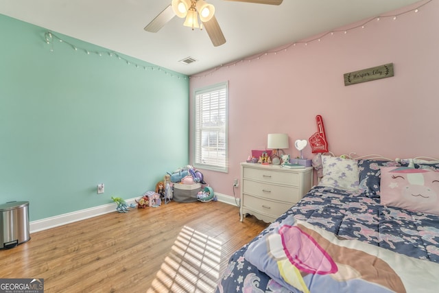 bedroom with ceiling fan and light hardwood / wood-style flooring