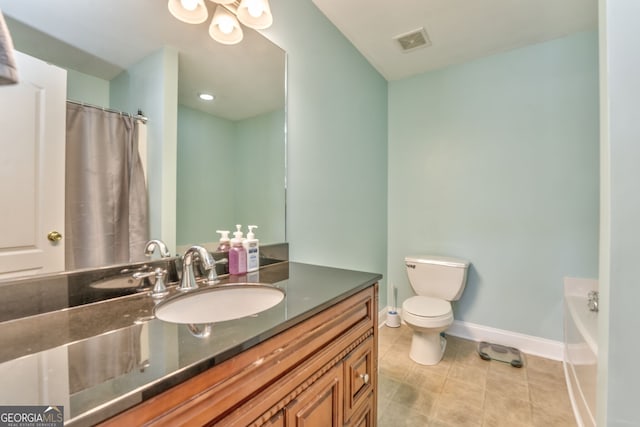 bathroom with toilet, vanity, tile patterned floors, and a bath