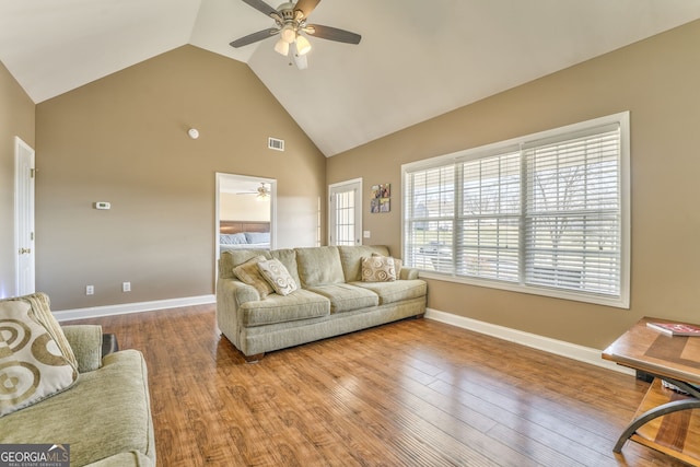 living room with vaulted ceiling, ceiling fan, and hardwood / wood-style floors