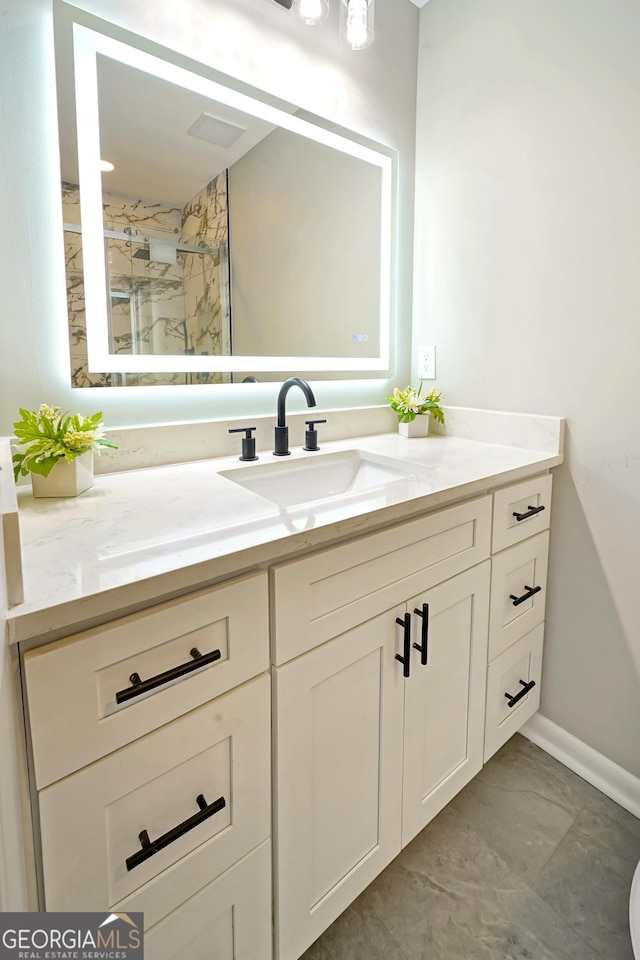 bathroom featuring vanity and walk in shower