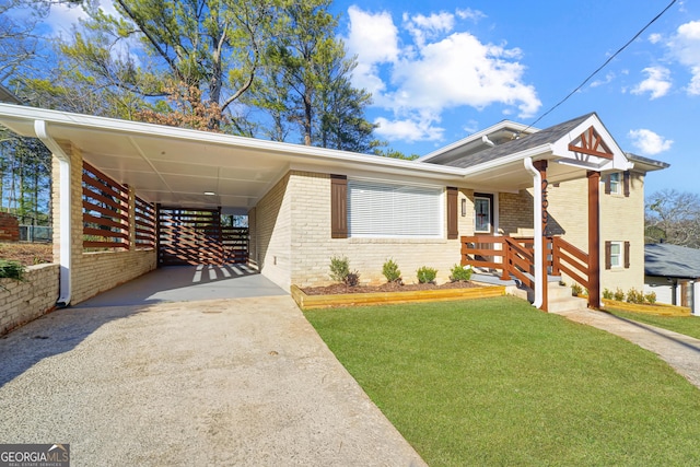 view of front facade with a carport, a front yard, and a porch