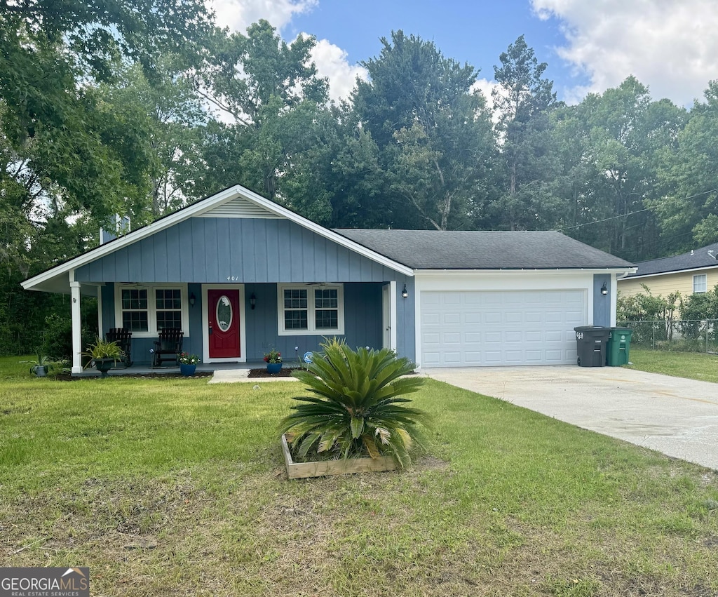 single story home featuring a porch, a garage, and a front lawn