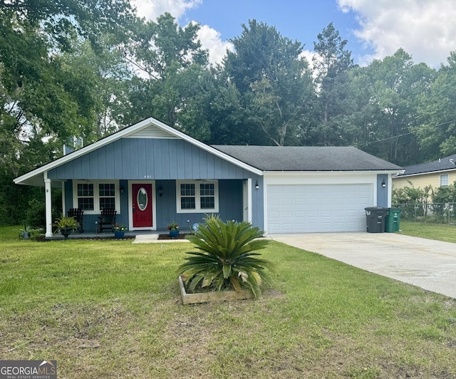 single story home featuring a porch, a garage, and a front lawn