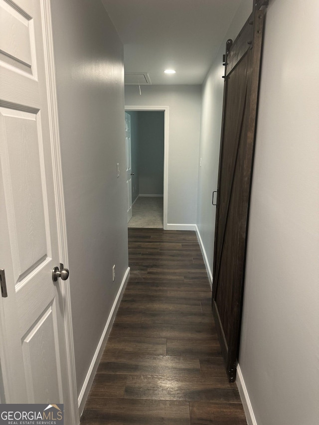 hallway featuring dark hardwood / wood-style flooring