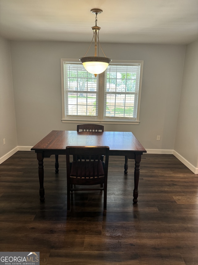 dining area featuring dark hardwood / wood-style floors