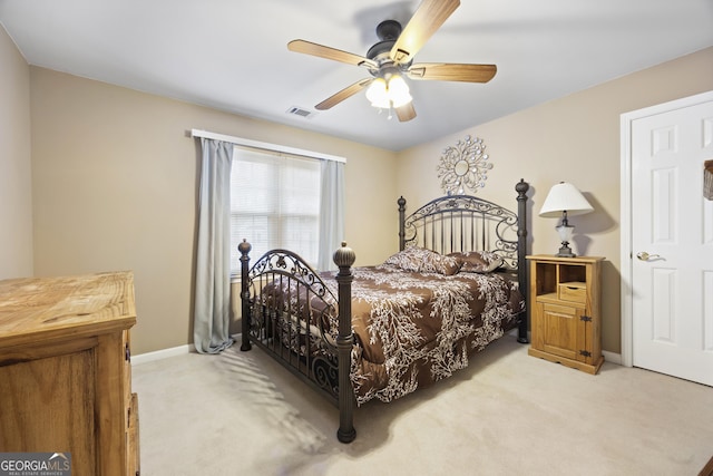 bedroom with light colored carpet and ceiling fan