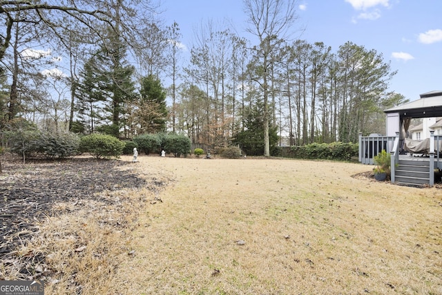 view of yard featuring a deck