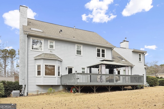 back of house featuring a gazebo, a deck, and central AC