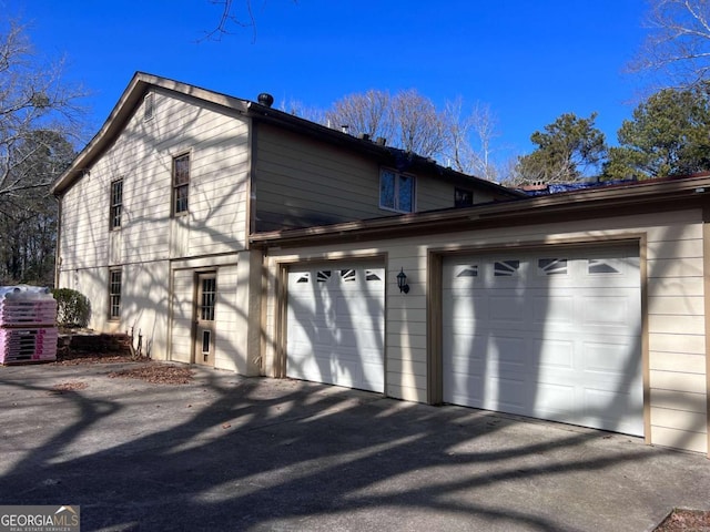 view of property exterior with a garage