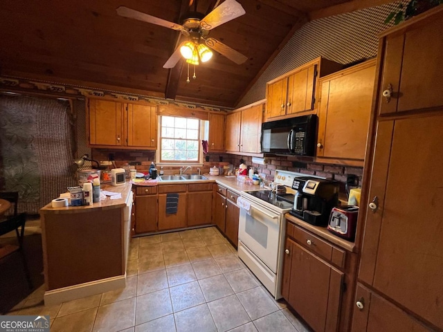 kitchen featuring vaulted ceiling, white range with electric stovetop, light tile patterned floors, ceiling fan, and sink