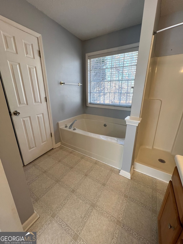 bathroom with independent shower and bath