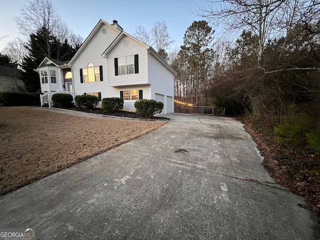 view of side of property with a garage