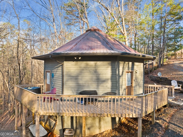 view of property exterior featuring a deck