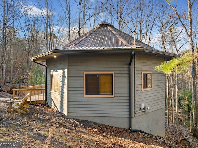 view of side of home with a wooden deck