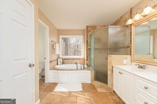 full bathroom with toilet, vanity, and independent shower and bath