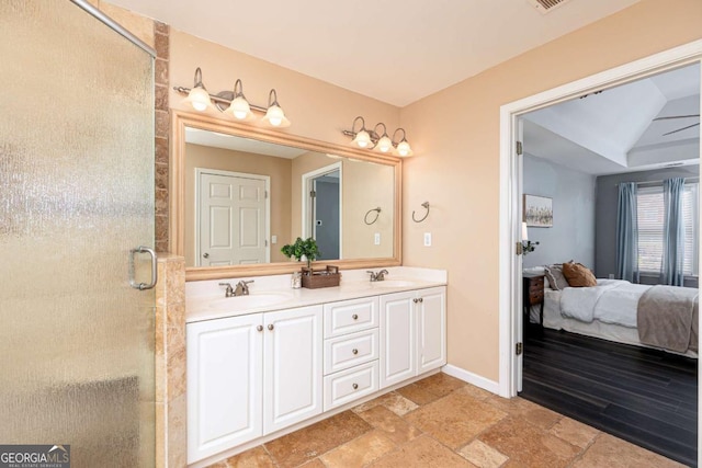 bathroom with vanity and a shower with shower door