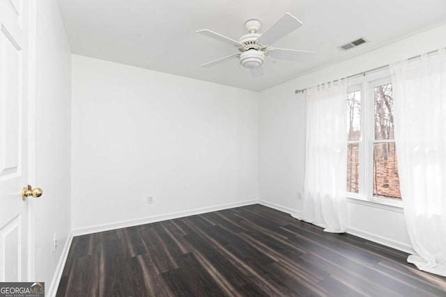 unfurnished room featuring ceiling fan and dark hardwood / wood-style floors