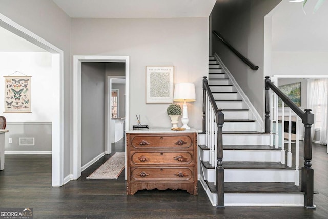 stairway with hardwood / wood-style flooring