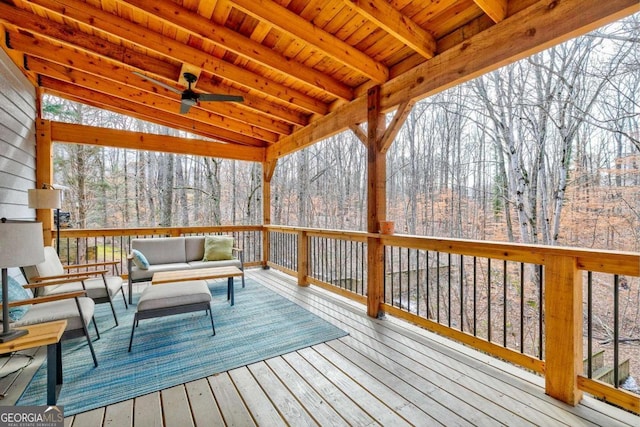 deck with ceiling fan and an outdoor living space