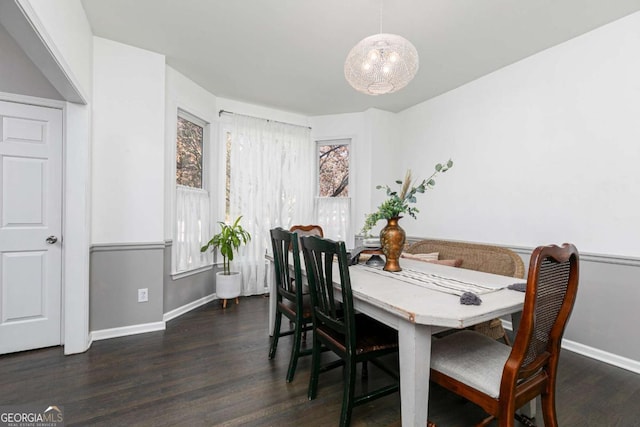 dining area featuring a chandelier and dark hardwood / wood-style floors