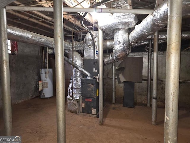 utility room featuring heating unit and gas water heater