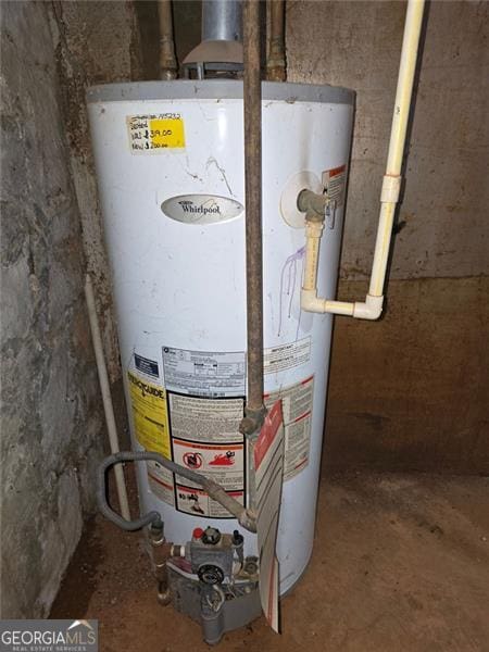 utility room featuring gas water heater