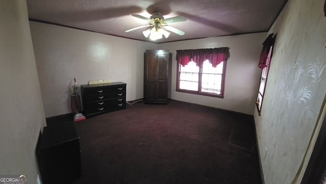 carpeted bedroom featuring crown molding, a textured ceiling, and ceiling fan