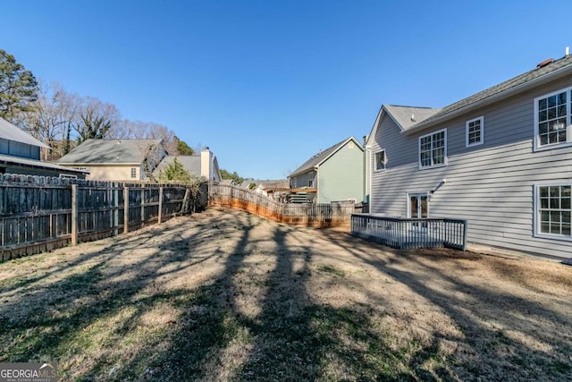 view of yard featuring a wooden deck