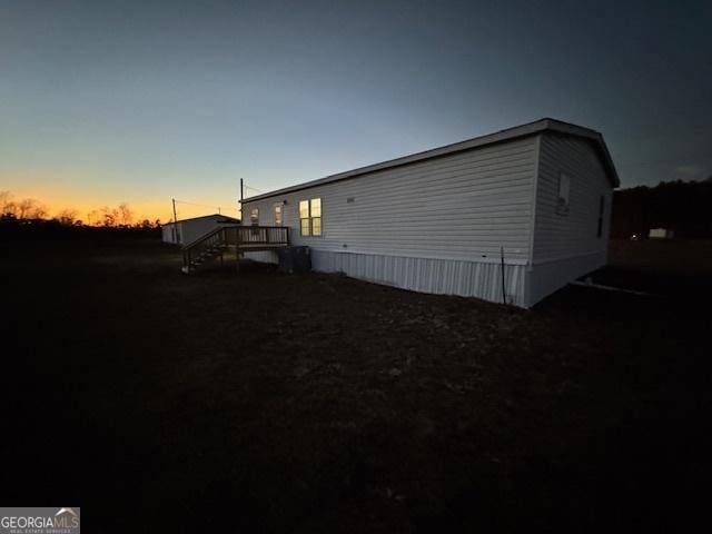 view of property exterior at dusk