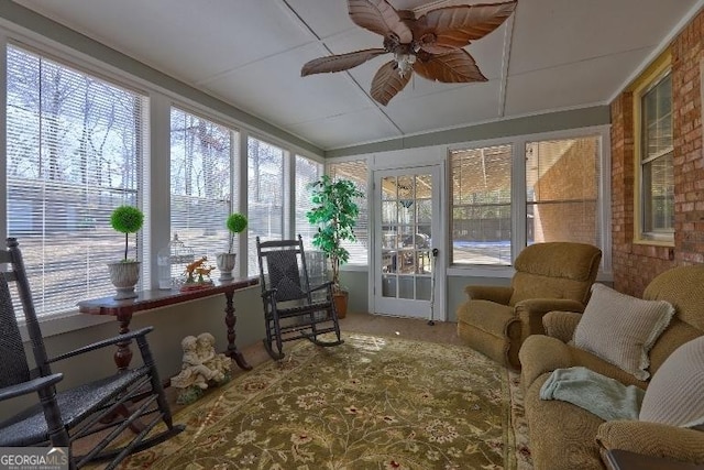 sunroom with ceiling fan and a wealth of natural light