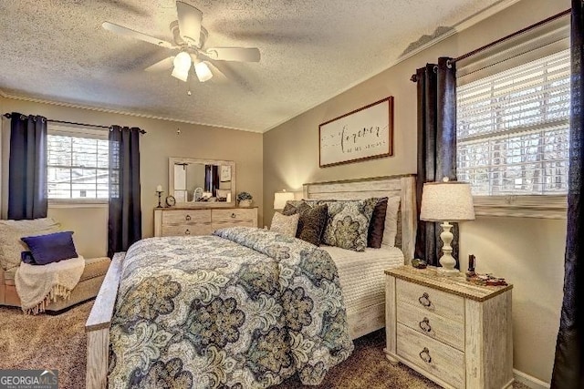 bedroom featuring carpet flooring, a textured ceiling, and ceiling fan