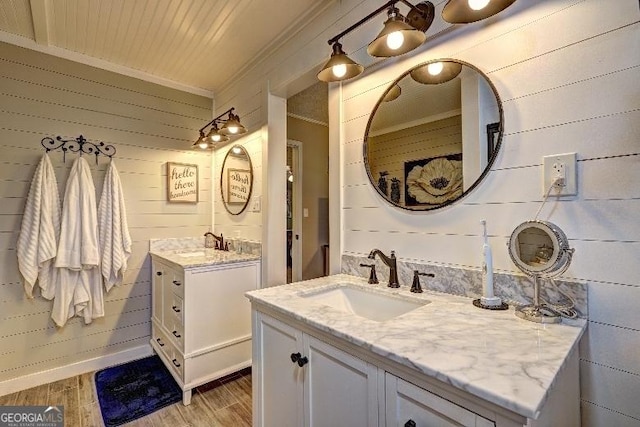 bathroom with vanity and ornamental molding