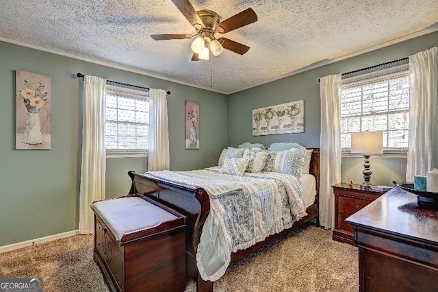 bedroom featuring ceiling fan, light colored carpet, and a textured ceiling