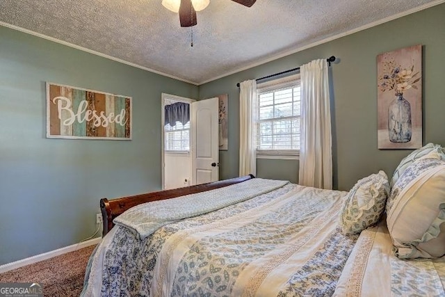 bedroom featuring ornamental molding, a textured ceiling, ceiling fan, and carpet