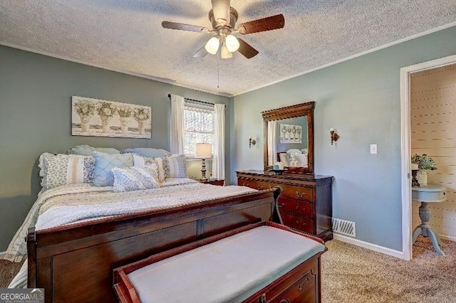 bedroom featuring a textured ceiling, ceiling fan, and light carpet