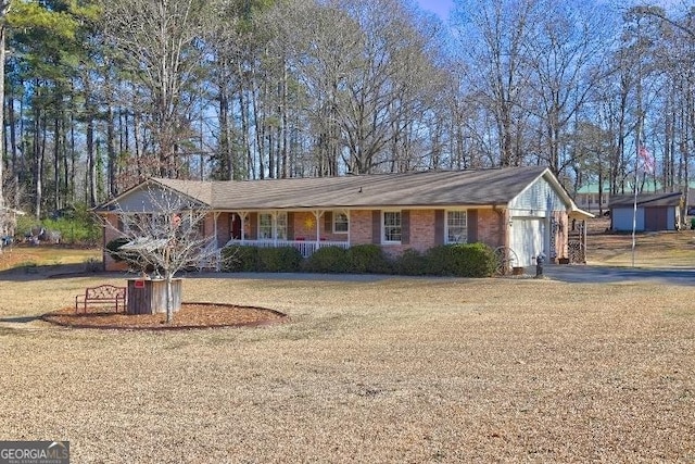 ranch-style home with a front yard and a garage