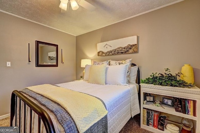 carpeted bedroom with a textured ceiling, ceiling fan, and ornamental molding