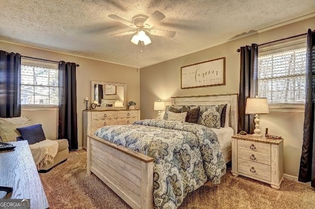 carpeted bedroom with a textured ceiling and ceiling fan