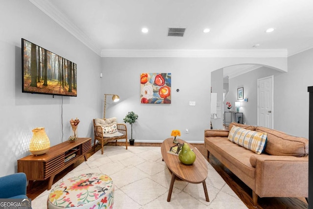 living room with ornamental molding