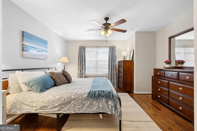 bedroom with hardwood / wood-style flooring and ceiling fan