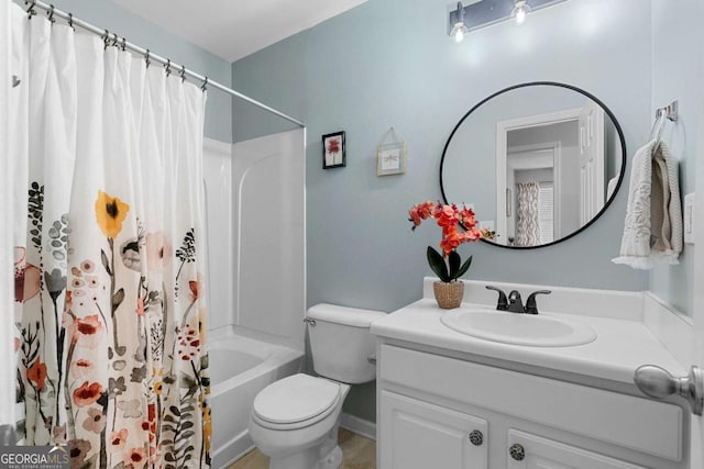 full bathroom featuring shower / tub combo with curtain, vanity, and toilet