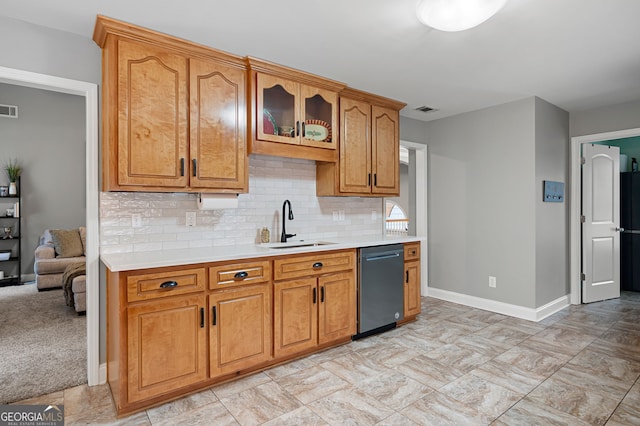 kitchen featuring sink, light colored carpet, decorative backsplash, and dishwasher