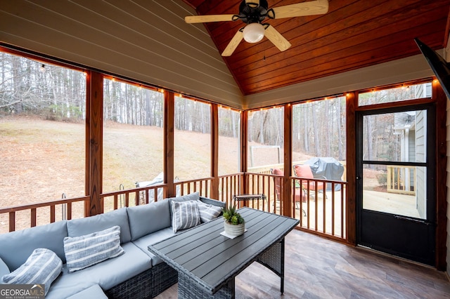 sunroom featuring vaulted ceiling, ceiling fan, and wooden ceiling