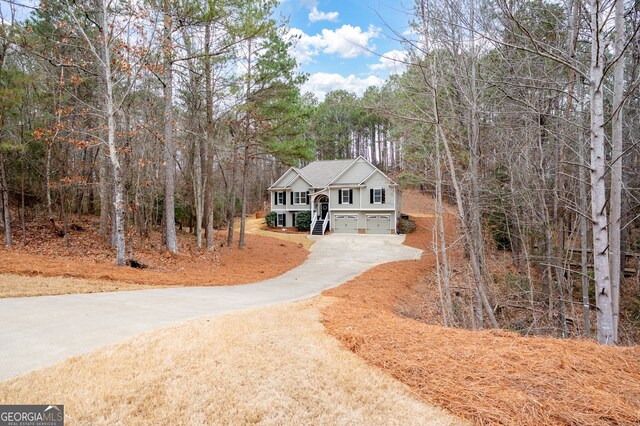 raised ranch with a porch and a garage