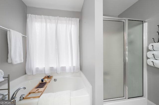 bathroom with separate shower and tub