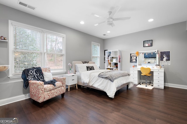 bedroom with dark hardwood / wood-style floors and ceiling fan