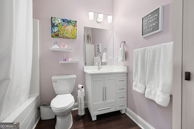 full bathroom featuring hardwood / wood-style floors, toilet, vanity, and shower / bath combination with curtain