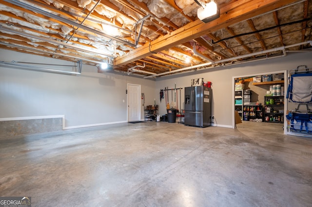 garage featuring stainless steel fridge