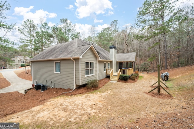 rear view of property featuring a porch